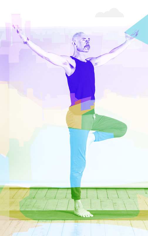 Jamie practising yoga against a Manchester cityscape